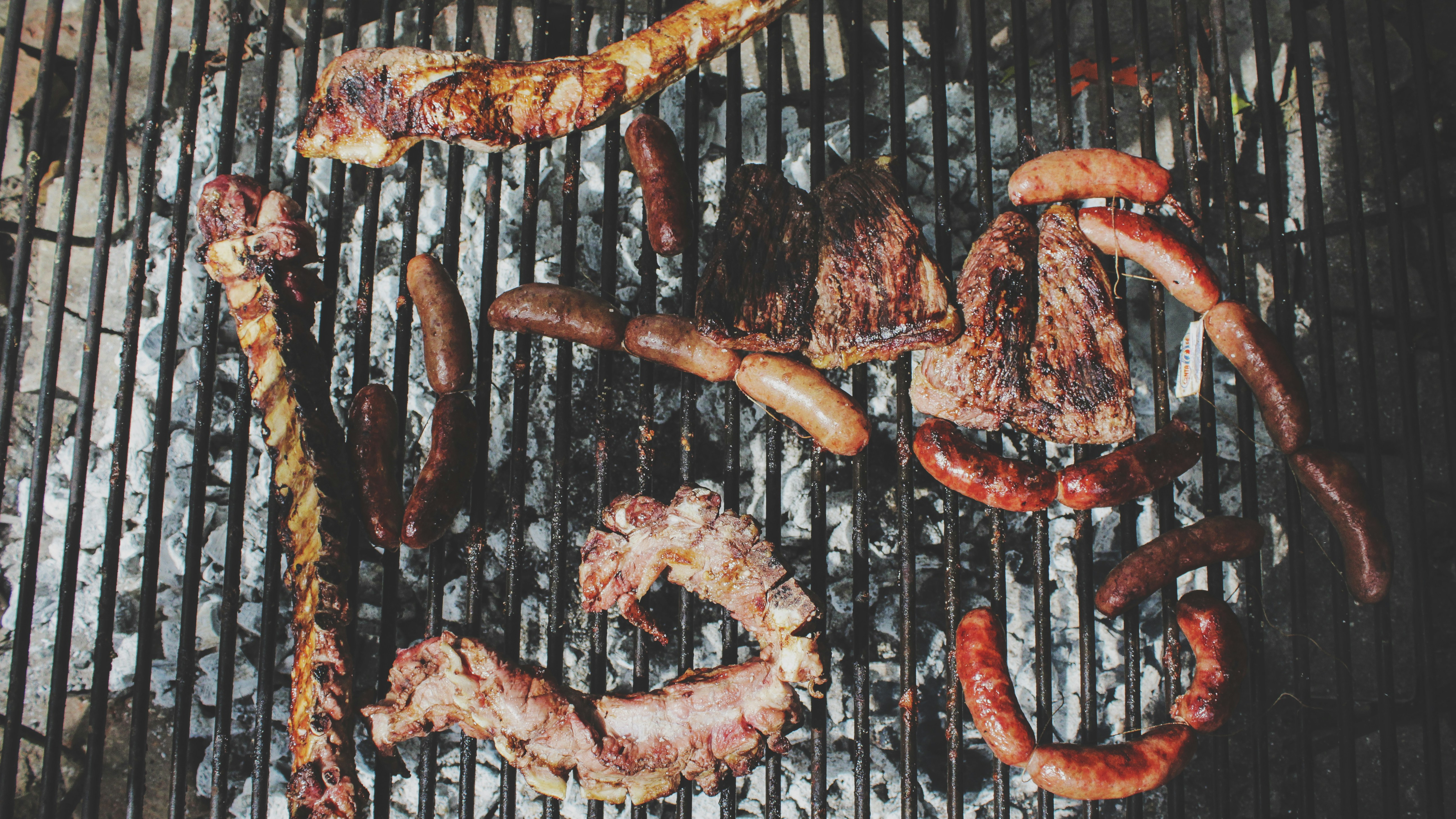 BBQ Meats on a grill, showcasing an assortment of deliciously grilled foods perfect for enhancing the introduction to gas barbecue techniques.