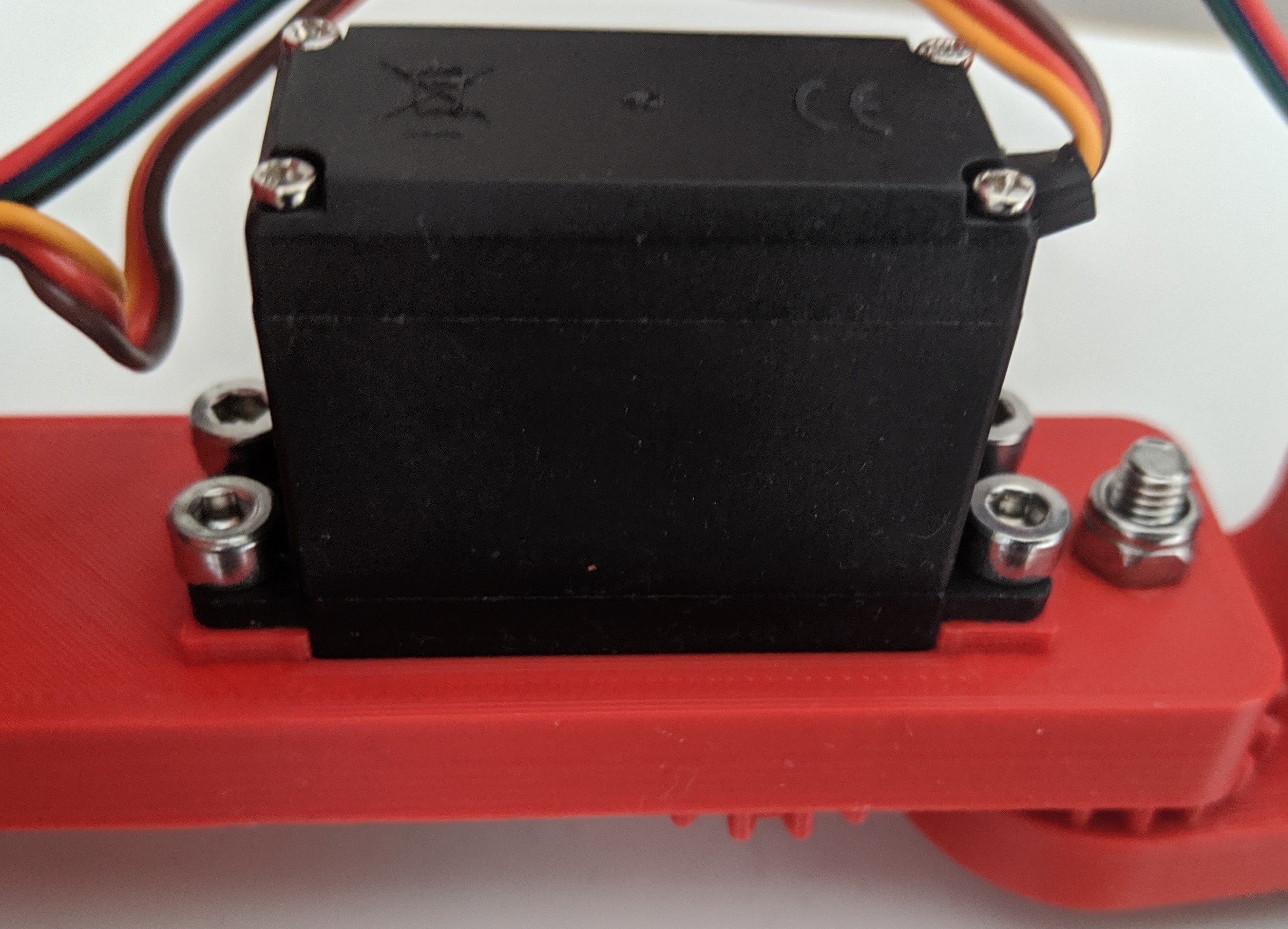 Attach servos with M4 bolt