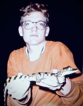 Holding a black caiman, Amazon River, Brazil. 1997